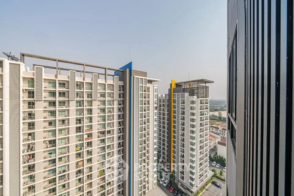 Modern high-rise apartment buildings with expansive city views and contemporary architecture.