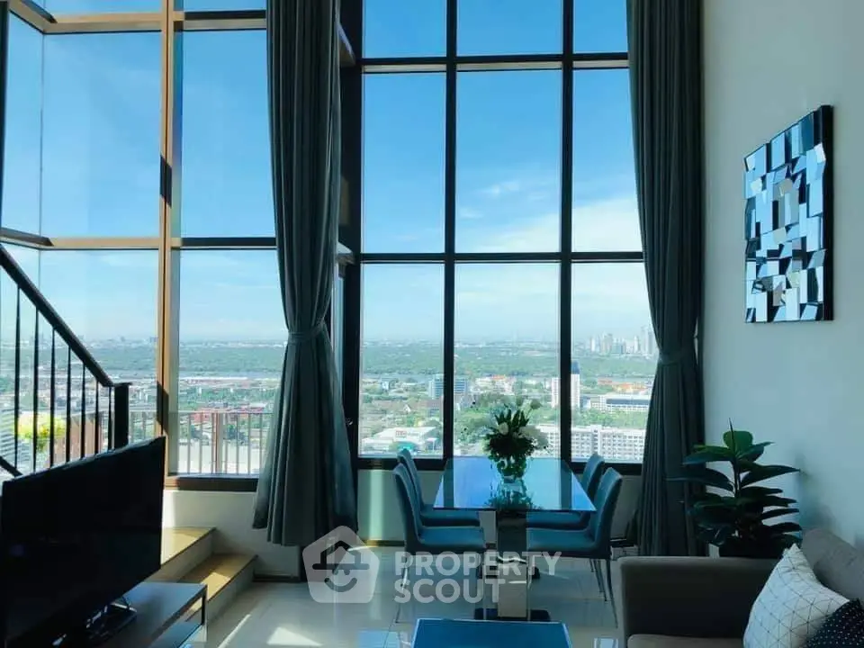 Luxurious high-rise living room with floor-to-ceiling windows and stunning city view