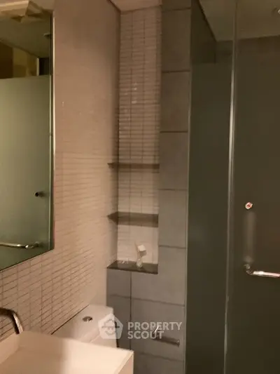 Modern bathroom with sleek design and glass shower enclosure