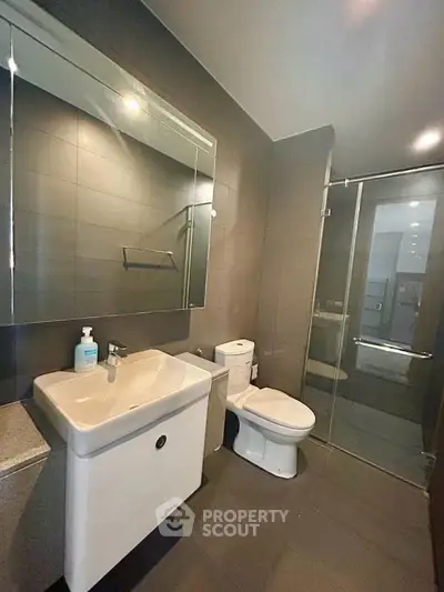 Modern bathroom with sleek design and glass shower enclosure