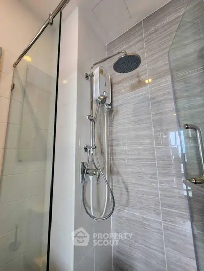 Modern bathroom shower with sleek glass door and contemporary fixtures