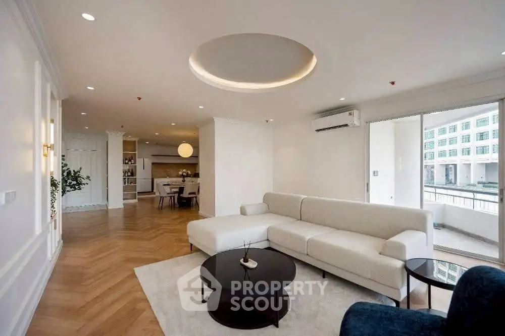 Spacious modern living room with elegant decor and open kitchen layout