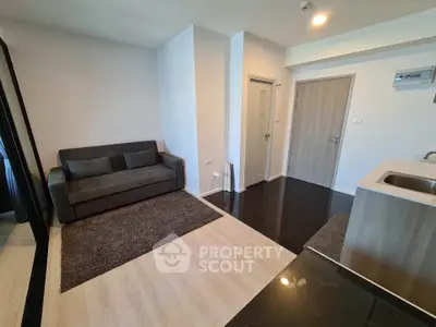 Modern living room with sleek design and cozy sofa in a stylish apartment.