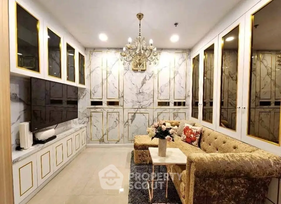 Luxurious living room with elegant marble walls and opulent chandelier