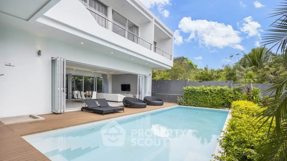 Luxurious modern villa with private pool and spacious deck, perfect for relaxation and entertainment.