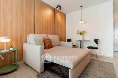 Modern living room with stylish furniture and wooden accent wall