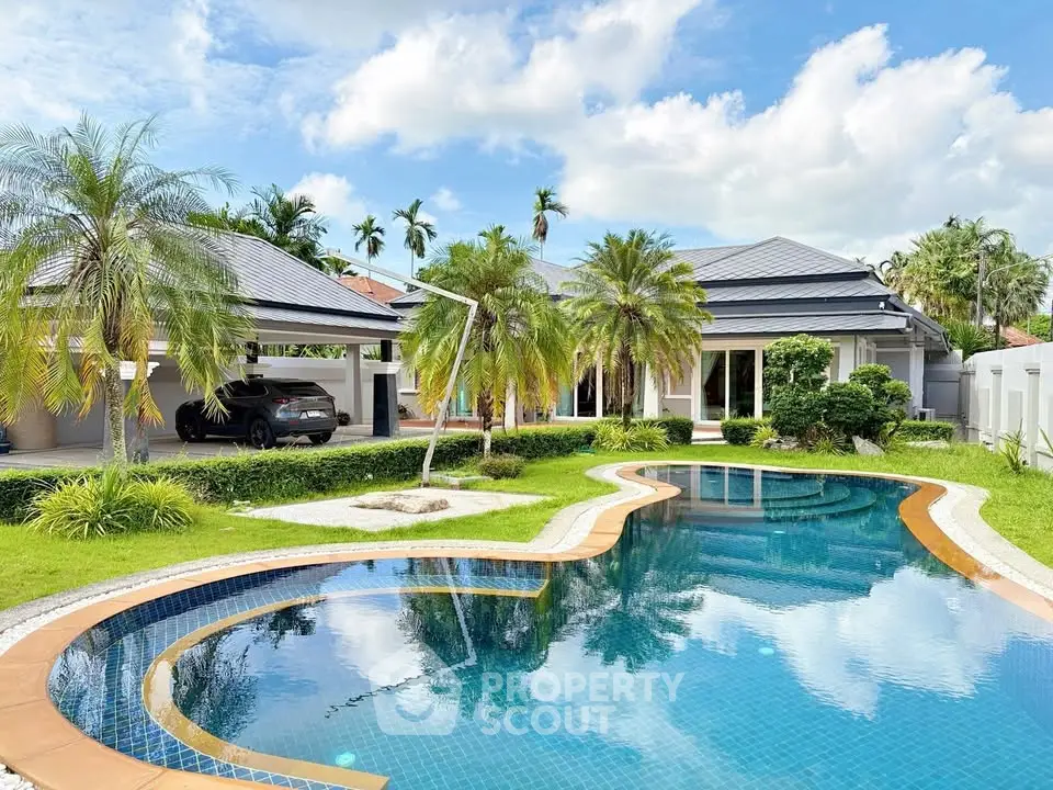 Luxurious villa with private pool and lush garden in tropical setting