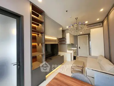 Modern living room with elegant chandelier and built-in shelving