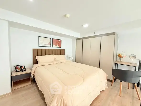 Modern bedroom with stylish decor and ample storage space