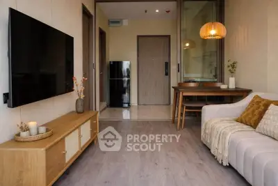 Cozy living room with modern decor and open dining area