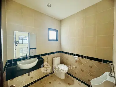 Modern bathroom with sleek fixtures and neutral tile design