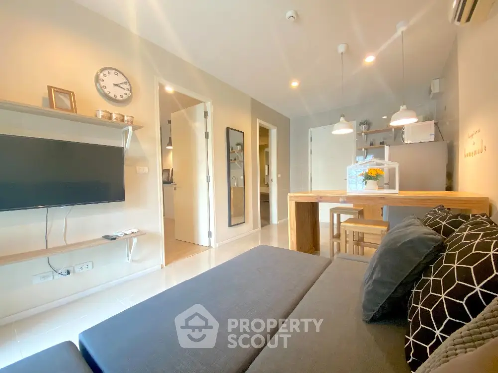 Modern living room with stylish decor and open kitchen layout