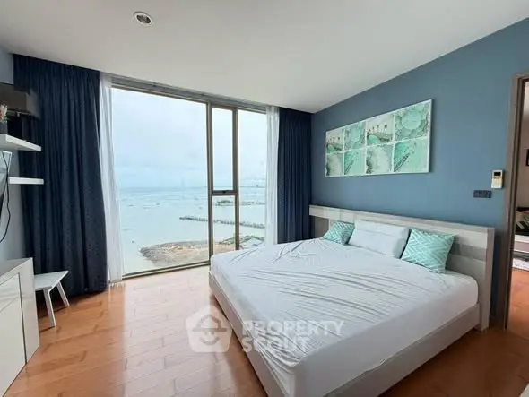 Spacious bedroom with stunning ocean view and modern decor