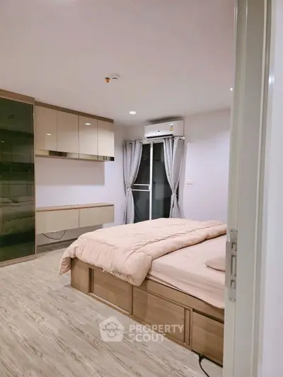 Modern bedroom with sleek design, featuring built-in storage and a cozy atmosphere.