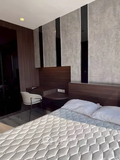 Modern bedroom with stylish decor and comfortable bed, perfect for relaxation.
