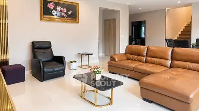 Spacious modern living room with leather sofa and elegant decor