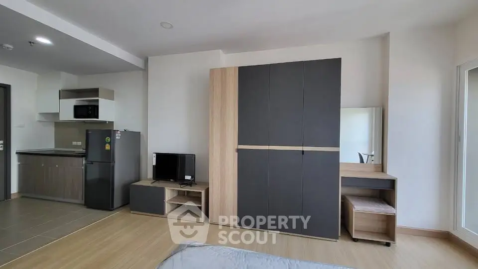 Modern studio apartment with open layout and sleek furniture
