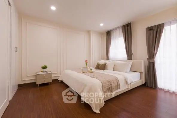 Elegant bedroom with cozy decor and natural light
