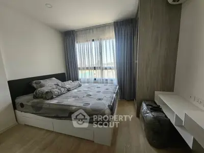 Modern bedroom with large window and stylish decor