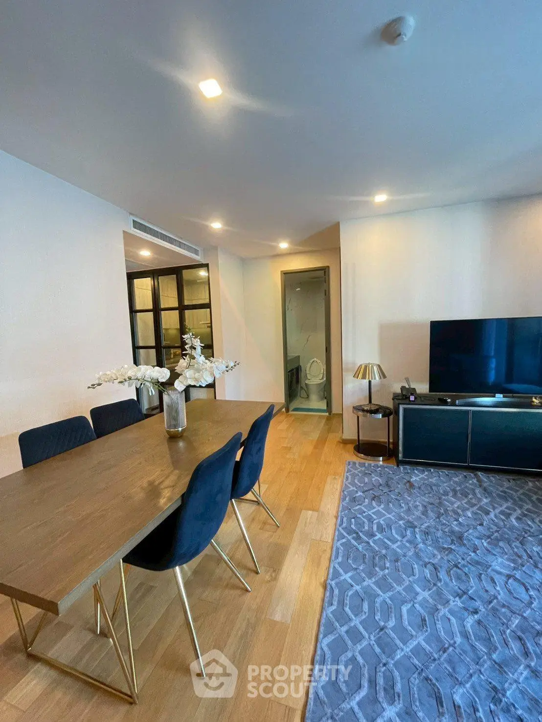 Modern living room with elegant dining area and stylish decor