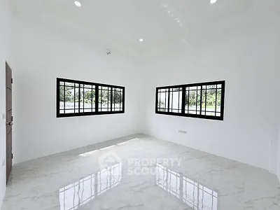 Spacious empty room with large windows and glossy tiled floor, perfect for customization.