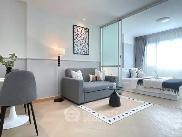 Modern living room with stylish decor and cozy seating area, perfect for relaxation and entertaining.