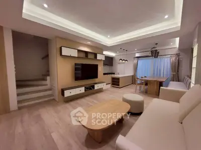 Spacious modern living room with open kitchen and stylish wooden furniture