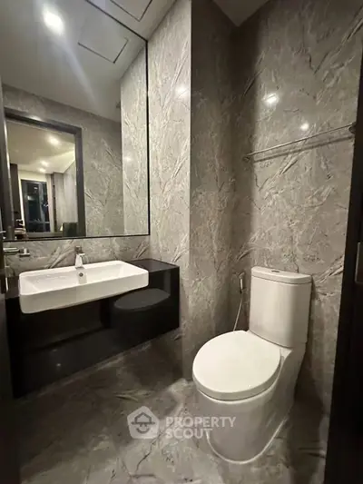 Luxurious modern bathroom with elegant marble walls and sleek fixtures