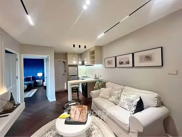 Modern living room with cozy seating and stylish decor in a contemporary apartment.