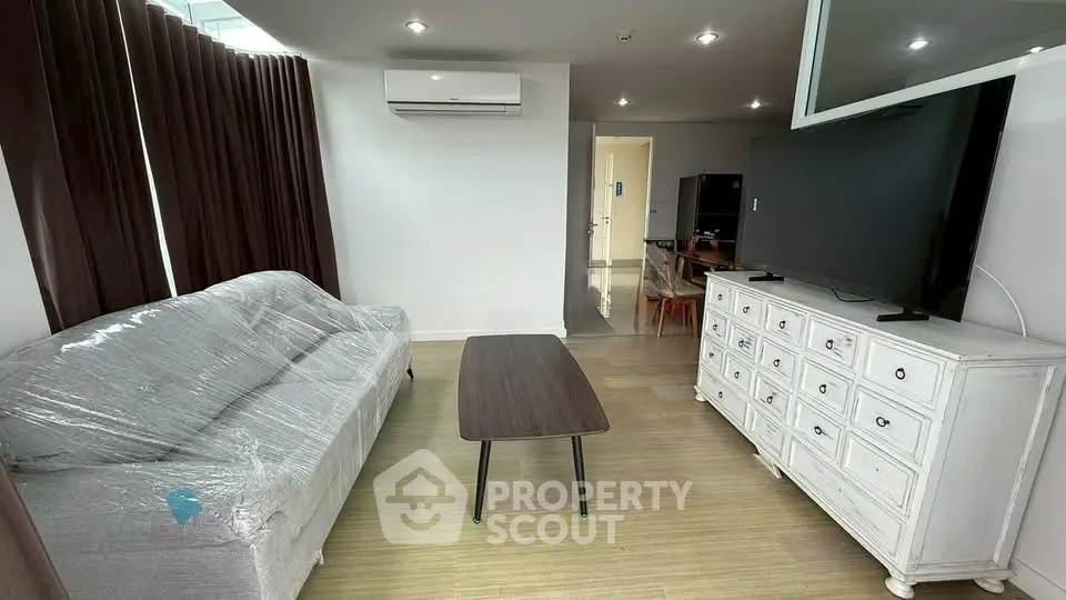 Modern living room with air conditioning and stylish furniture in a contemporary apartment.