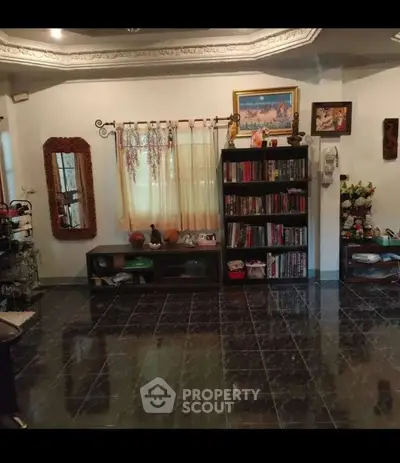 Spacious living room with elegant decor and ample natural light