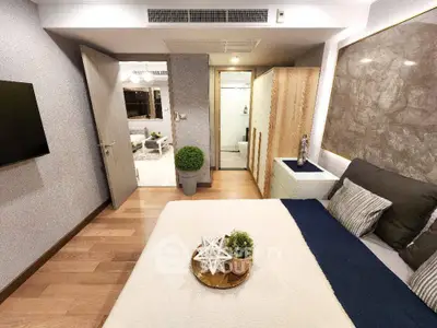 Modern bedroom with stylish decor and open view to living area