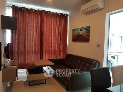 Modern living room with stylish furniture and air conditioning, perfect for relaxation.