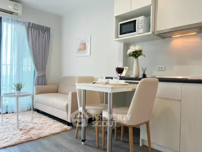 Modern cozy living room with kitchen in open layout, featuring stylish furniture and natural light.