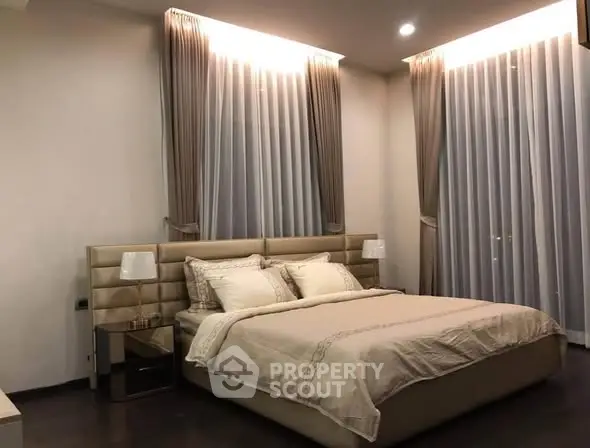 Luxurious bedroom with elegant curtains and modern decor