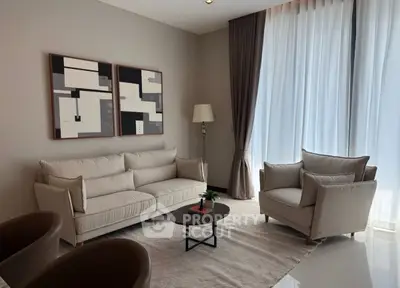 Elegant living room with modern furniture and large windows