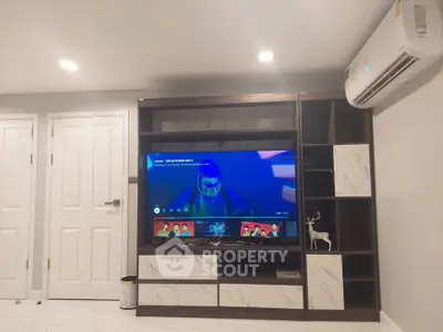 Modern living room with sleek entertainment center and air conditioning unit