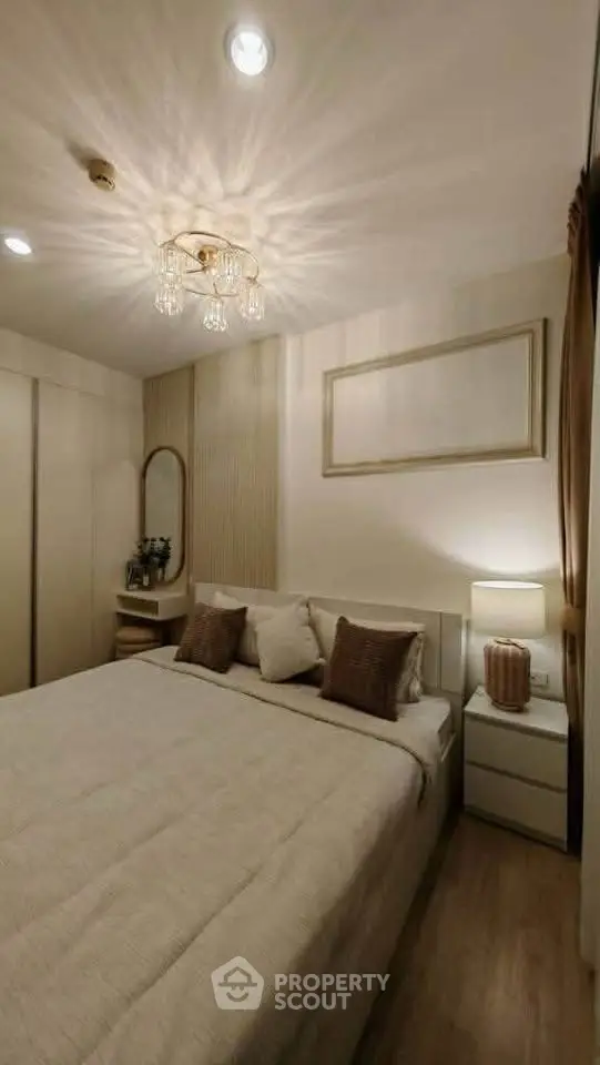 Cozy bedroom with elegant lighting and modern decor, perfect for relaxation.