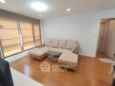 Spacious living room with modern furniture and natural light