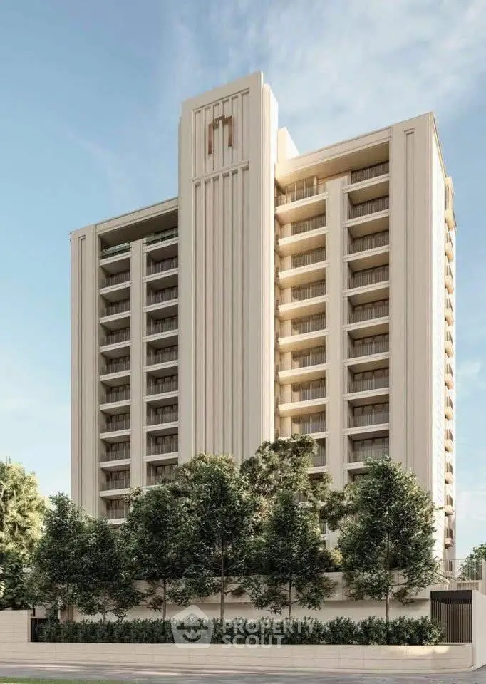 Modern high-rise building with elegant facade and lush greenery