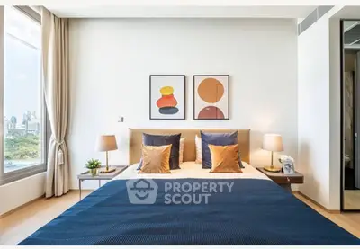 Modern bedroom with stylish decor and city view, featuring a cozy bed and elegant lighting.