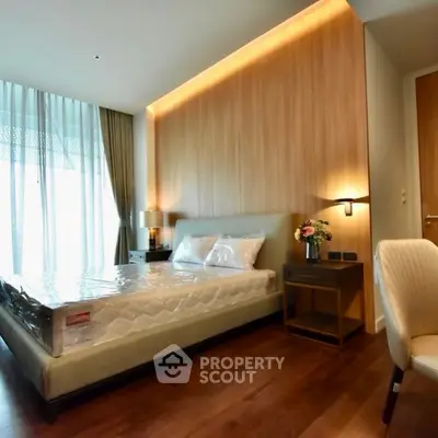 Modern bedroom with elegant lighting and wooden accents