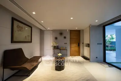Luxurious modern living room with elegant decor and spacious layout, featuring stylish furniture and ambient lighting.