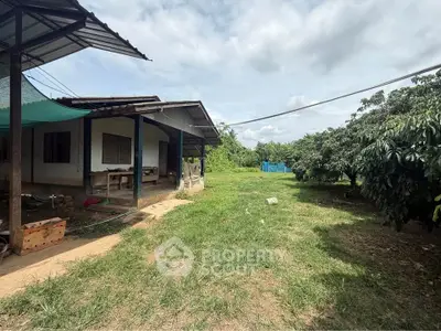 Charming rural property with spacious yard and lush greenery, perfect for nature lovers seeking tranquility.