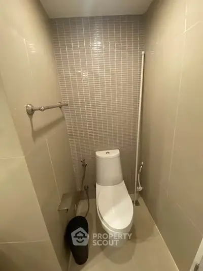 Modern bathroom with sleek toilet and stylish tile design