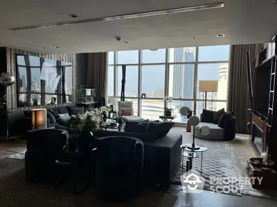 Luxurious living room with panoramic city views and elegant modern furnishings.