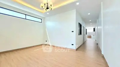 Spacious modern living room with elegant lighting and wooden flooring