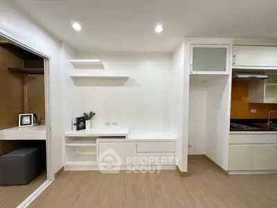 Modern minimalist apartment interior with open kitchen and study area