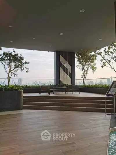 Stunning rooftop terrace with panoramic city views and modern seating area.