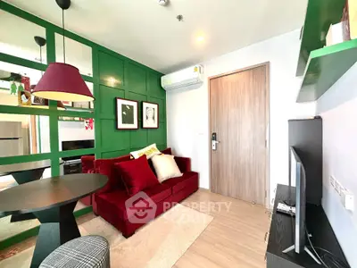 Stylish living room with vibrant red sofa and modern decor